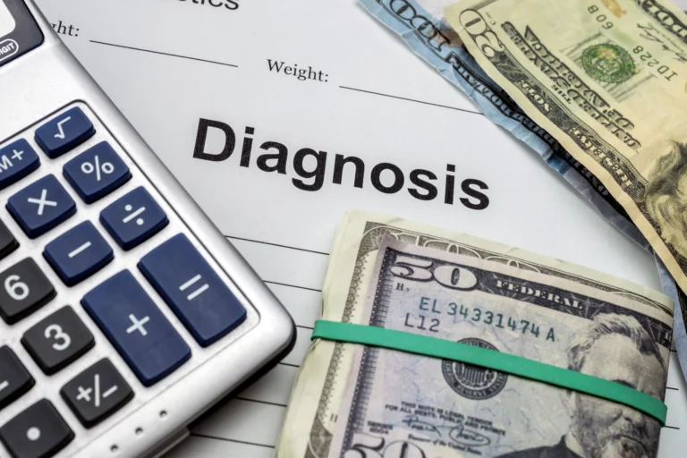Calculator and stack of cash placed on a medical document labeled “Diagnosis,” representing high healthcare costs and medical debt discharge through Chapter 7 bankruptcy.